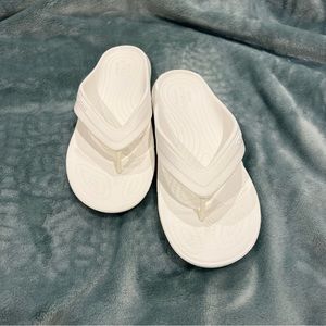 CROCS flip flops. White. Size 6/7